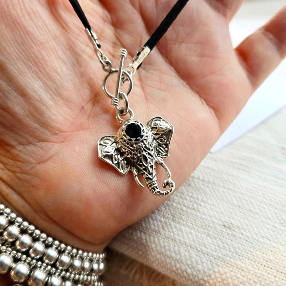 Jewelry - Handcrafted sterling silver pendant with a sude cord 18in
